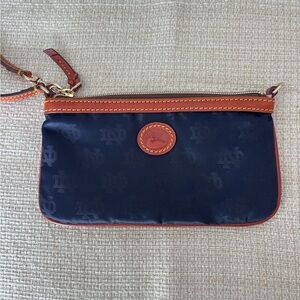 Dooney & Bourke Notre Dame Navy and Tan Wristlet. Like new, great condition.